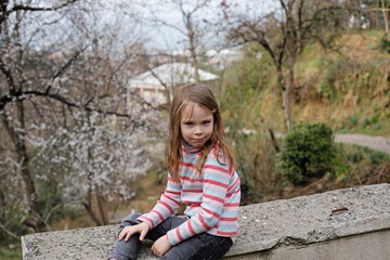 Naklejka na ściany i meble Funny girl in cotton longsleeve outdoor