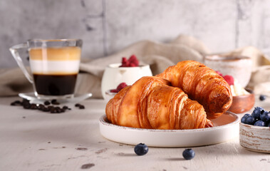 croissant with fresh berries for breakfast
