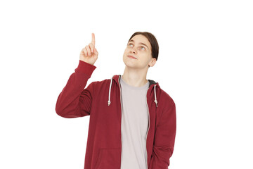 Handsome man pointing finger up against white studio wall background