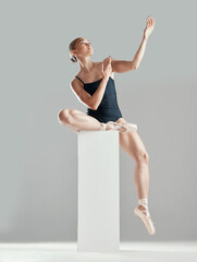 Performance, ballerina or woman on block in studio in creative routine or elegant act for art or...