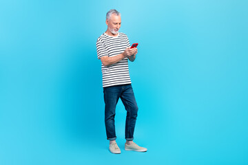 Full length photo of addicted user pensioner writing letter modern iphone samsung wifi connection...