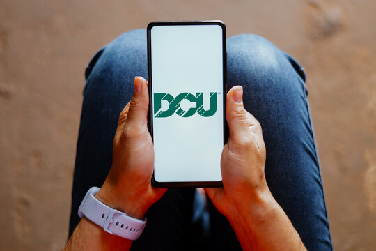 August 17, 2023, Brazil. In this photo illustration, the Digital Federal Credit Union (DCU) logo is displayed on a smartphone screen.
