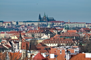 Naklejka na ściany i meble Town centre view in Prague with Prague castle. Czech republic capital city full of ancient architecture, culture, street artists.