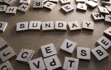 Sunday word on wooden blocks. Wooden blocks with letters on vintage background