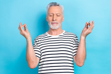 Photo of calm kind man wear summer clothes two hands demonstrate okey sign enjoy morning yoga...