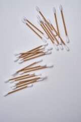 Bamboo cotton buds on a colored background. Biodegradable ear swabs. Eco product