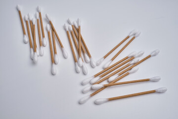 Bamboo cotton buds on a colored background. Biodegradable ear swabs. Eco product
