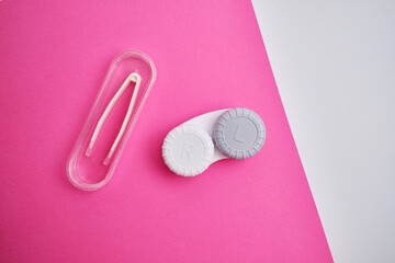 Container for lenses and accessories on a light background. Health and medicine concept
