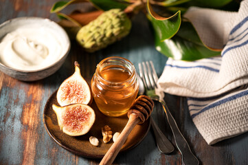 Delicious Greek honey from Rhodes with figs and bowl of yogurt