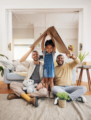 Gay, happy family and a child with cardboard home or roof with love, care and safety in a lounge....
