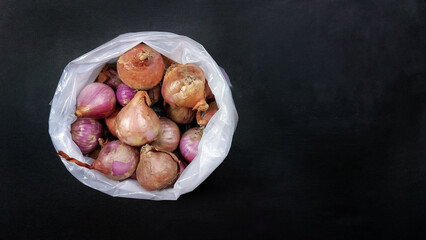 Fresh onions on a black background.Copy space