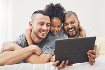 Tablet, gay family and child on a bed at home for e learning, watch video and education on internet. Adoption, lgbt men or parents with a happy kid and technology for streaming movies, games or app