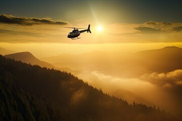 A black helicopter flies above the Rocky Mountains. dramatic sunrise. View from the air of clouds and mountains.