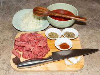 Preparing  base ingredients to make a ragu, beef bolognese or chilli