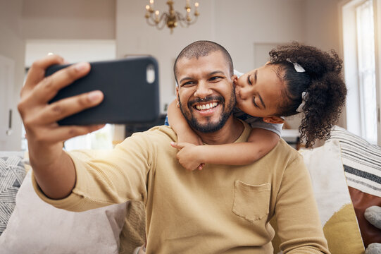 Father, girl and selfie kiss in home living room, bonding and having fun together. Dad, child and hug in profile picture, happy memory and smile on social media post of family on sofa, love and care