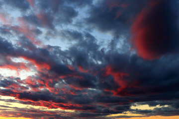 
Dramatic sunset sky with clouds in red and blue tones over Montreal, Quebec, Canada
