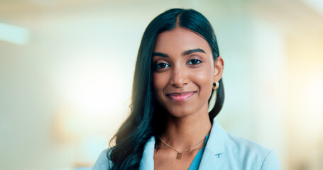 Satisfied, confident entrepreneur doing an online training for a remote, distance job. Closeup face portrait of a successful business woman standing and smiling against a bokeh, copyspace background.