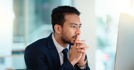 Stressed web developer suffering with mental block while trying to code on a computer in his...