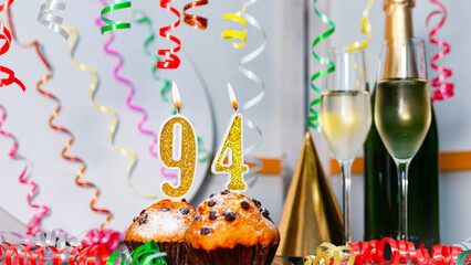 Solemn cake for an anniversary with a number  94. Happy birthday background with champagne bottle...