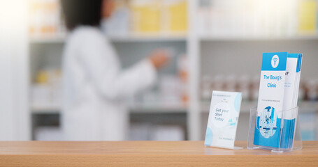 Focus on an information pamphlet on a counter at a pharmacy, advertising treatment and health care...