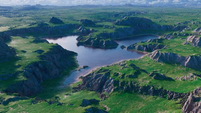 Lake in the mountains, aerial dolly shot. 3d animation.