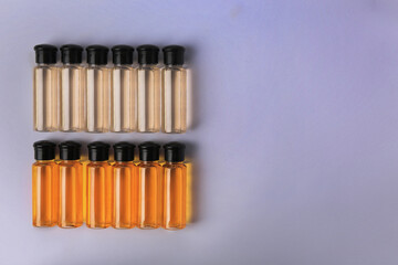 Bottles of cosmetic products on white background, flat lay. Space for text