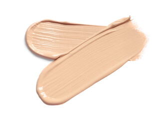 Smears of skin foundation isolated on white, top view