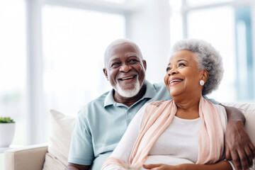 Portrait of a happy, smiling black senior couple at family gathering indoors