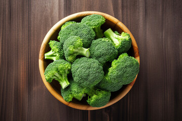 Broccoli on wooden bowl background