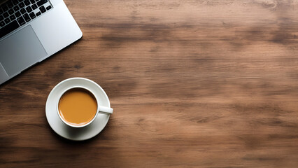 Coffee cup with laptop blank screen on wooden table. Top view with copy space. High quality photo