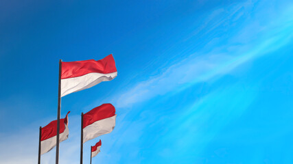 17 August 1945, Indonesian flags against sky background. Independence day concept