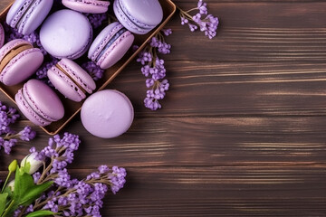 Macarons with lavender flower on wooden background.