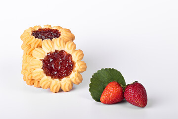 Shortbread with strawberry jam close-up with strawberries on a white background