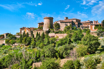 Fototapeta na wymiar Gualdo Cattaneo (Umbria, Italy) is a town rich in many vestiges of the past including a castle from the 1100s. It is surrounded by green hills.