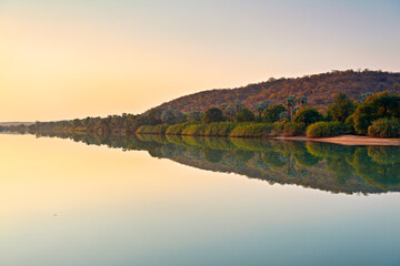 Namibia. The calm waters of Okavango river in Kavango region, at dusk