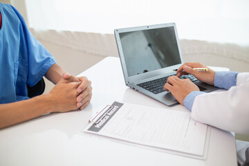 A heart patient visits a doctor for advice on health care and medication to treat heart disease symptoms after the medical team has diagnosed and examined the patient for heart abnormalities.