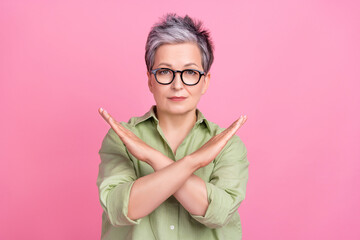 Photo of serious confident mature age businesswoman crossed arms against discrimination restriction isolated on pink color background - obrazy, fototapety, plakaty