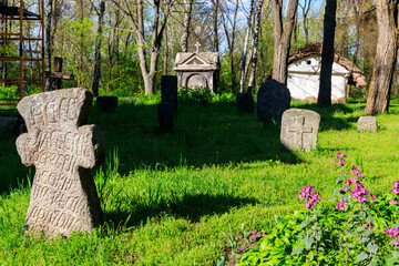 Old stone gravestones in the old abandoned cemetery