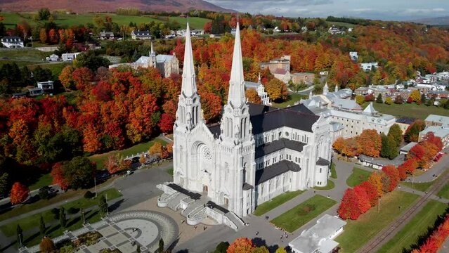 Rotating drone footage over Sanctuaire Sainte-Anne-de-Beaupre Basilica in Quebec, Canada