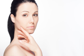 Naklejka premium Beautiful young woman on isolated background. Beauty concept photo. Skincare. Facial treatment, Cosmetology, plastic surgery.