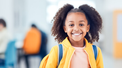 Happy little african american girl with backpack over school background. Childhood, school and education concept.

