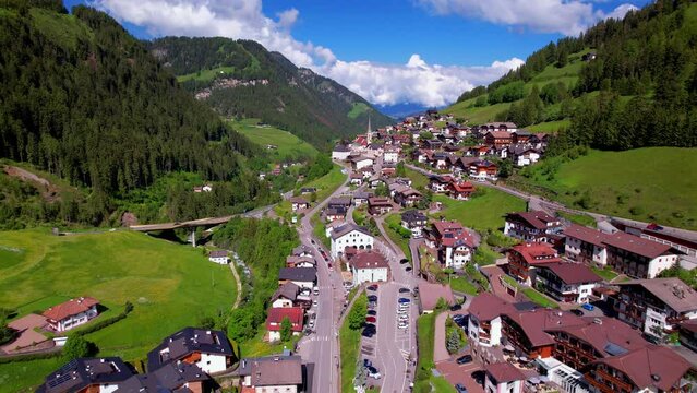 Alps mountains Dolomites, Val Gardena ,view of Santa Cristina village ski resort in south Tyrol in northern Italy. Alpine nature scenery. aerial drone 4k hd video