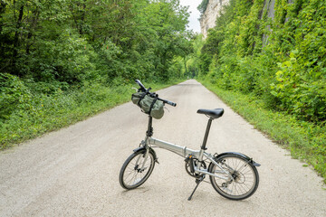 Fototapeta na wymiar lightweight folding bike on Katy Trail near Rocheport, Missouri, summer scenery. The Katy Trail is 237 mile bike trail converted from an old railroad.
