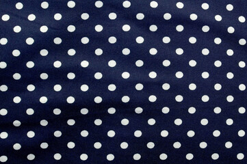 Blue fabric design with small white circles, space for text