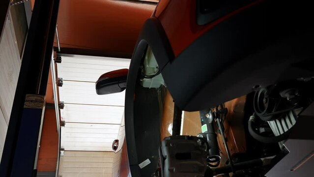 Complete removal of the wheel arch extender by a service station employee. Wheel arch spacer. The plastic wheel arch extender was removed from the car for further diagnostics and body work. High 4k