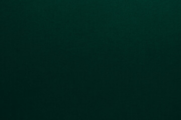 Abstract dark green paper background. Blank green paper texture