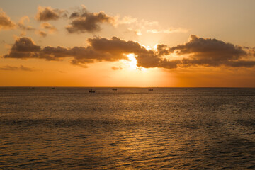 Warm sunset against the background of the ocean