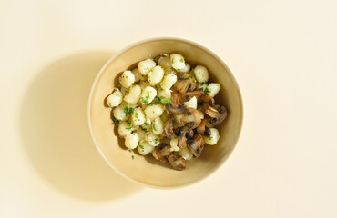 Potato Gnocchi with mushrooms and greens