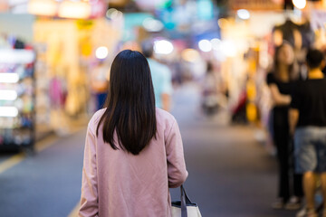 Tourist woman go street market at night in Taiwan - Powered by Adobe