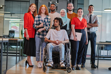 A diverse group of young business people congregates within a modern startup's glass-enclosed office, featuring inclusivity with a person in a wheelchair, an African American young man , and a hijab